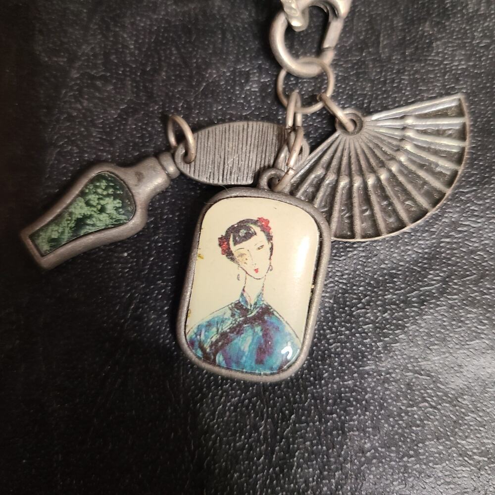 Shanghai themed wallet chain with fan portrait and bottle